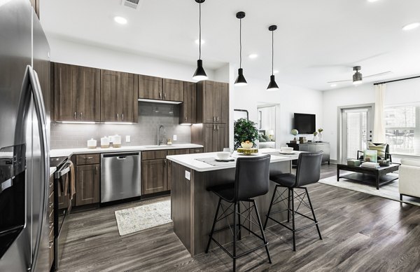 Modern kitchen with stainless steel appliances at The Vaughan Apartments luxury living