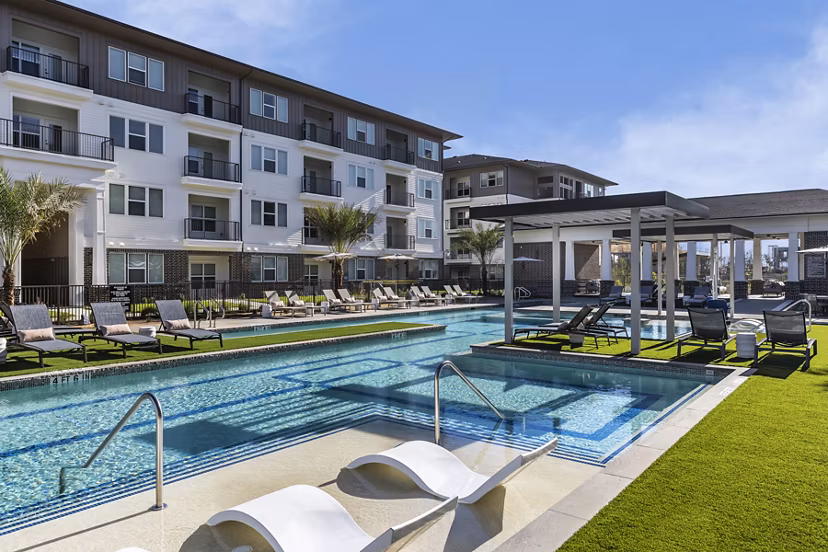 Refreshing pool with sundeck at The Vaughan Apartments, perfect for relaxing luxury living
