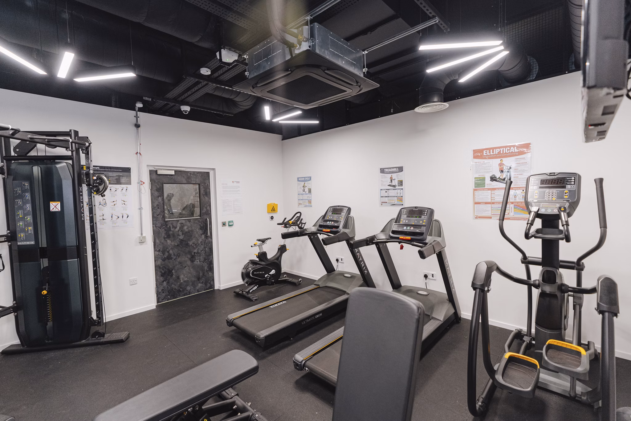 Close-up view of the fitness equipment at Chapter Westminster, showcasing weights, treadmills, and gym machines