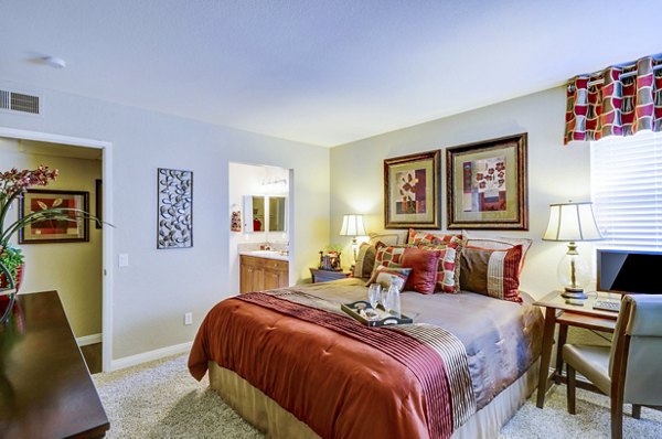 Cozy bedroom featuring elegant decor at Adagio Apartments