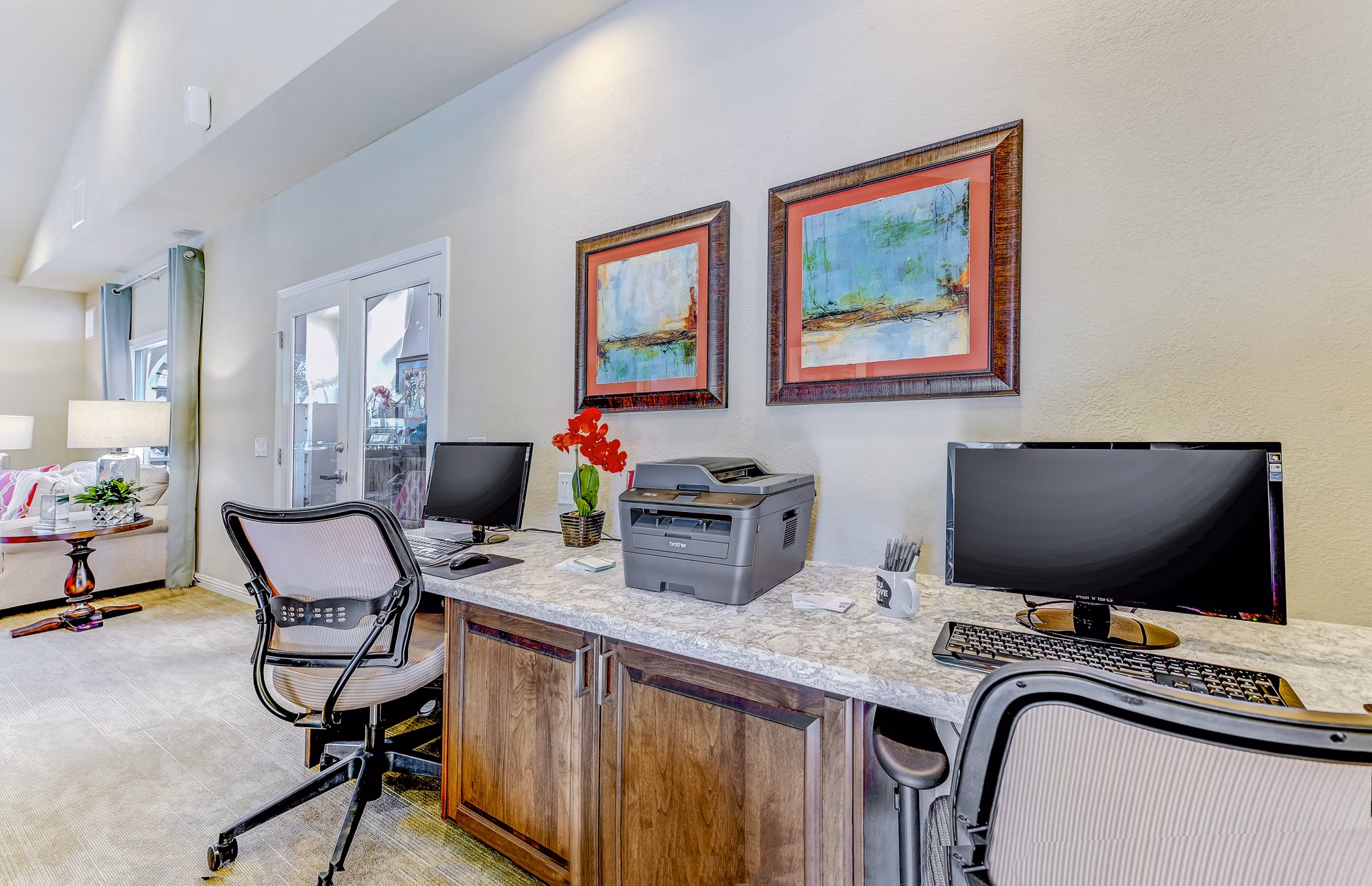 Contemporary business center featuring modern workstations at Adagio Apartments