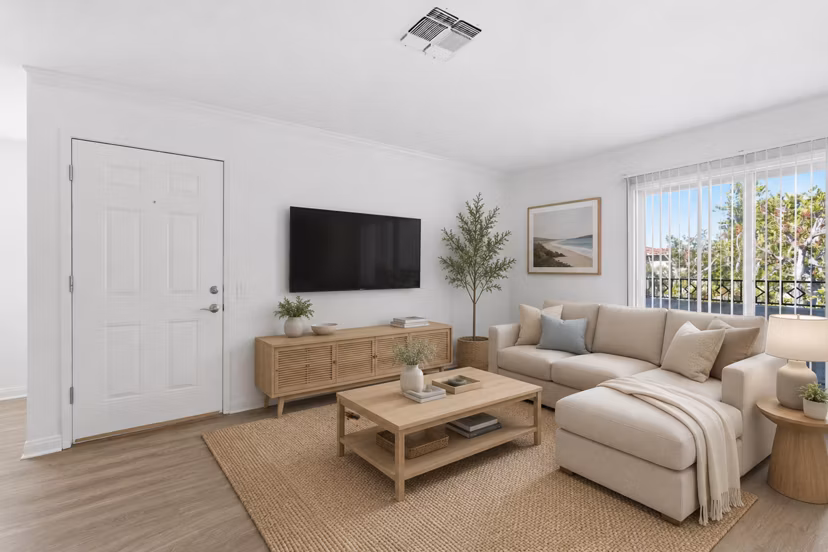 Living room with modern furnishings and large windows at Adagio Apartments