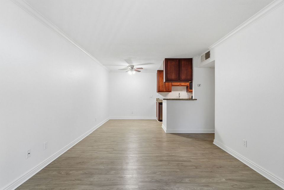 Spacious living room with modern furnishings and natural light in Adagio Apartments