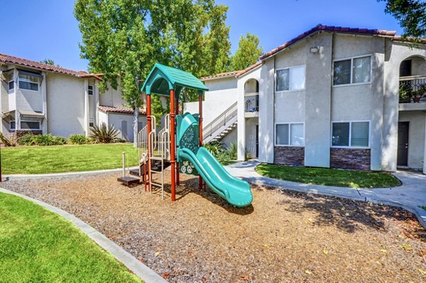 Modern playground with vibrant equipment at Adagio Apartments, a Greystar community in a family-friendly neighborhood