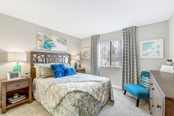 Comfortable bedroom with stylish decor at Altair Apartments