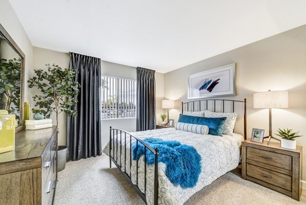Cozy bedroom with elegant decor at Altair Apartments, luxury living by Greystar