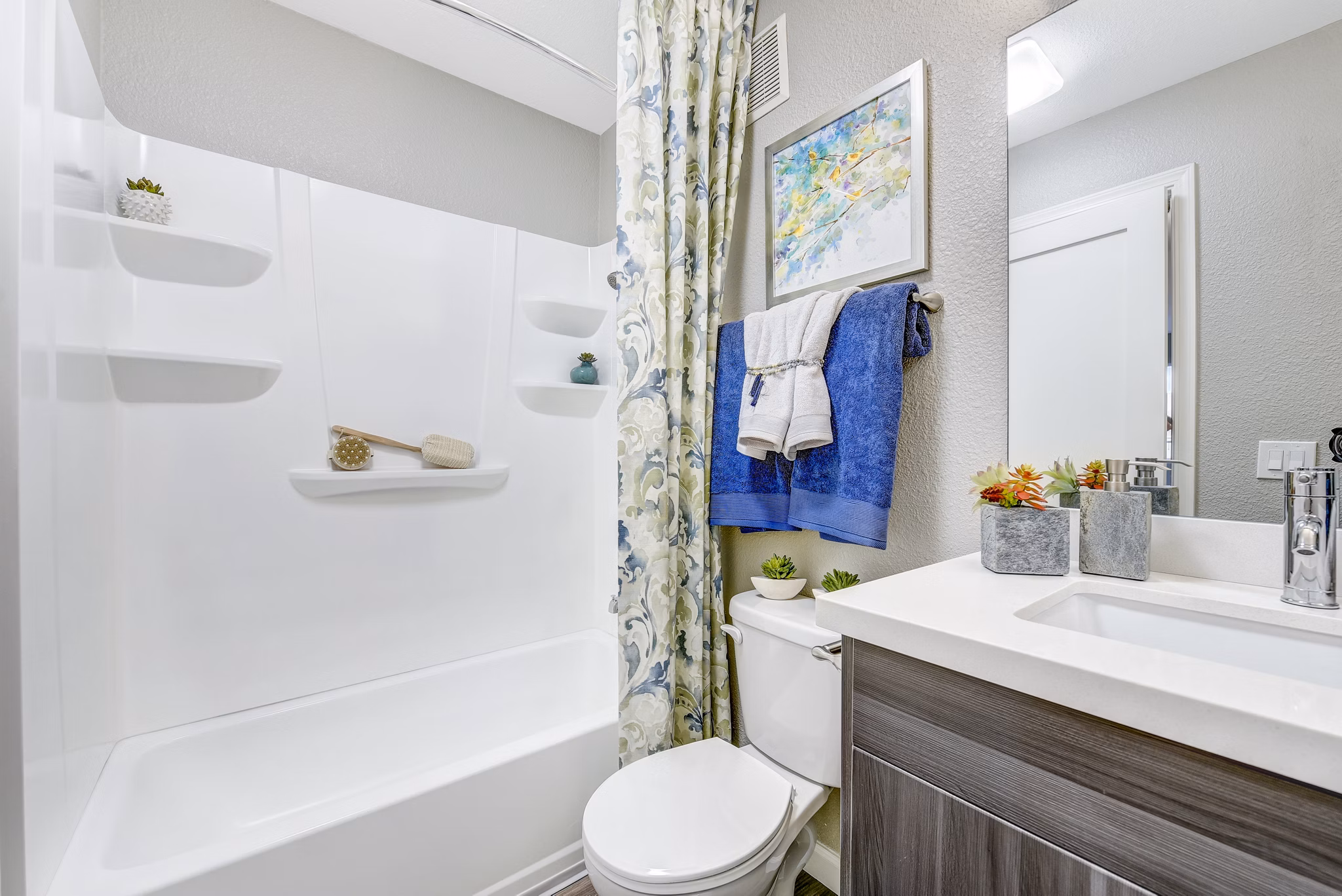 Altair Apartments: Modern bathroom with sleek fixtures and tile accents