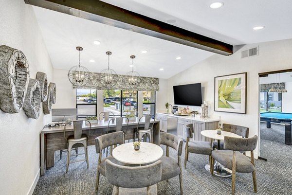 Altair Apartments: Modern clubhouse and leasing office with stylish decor and seating areas