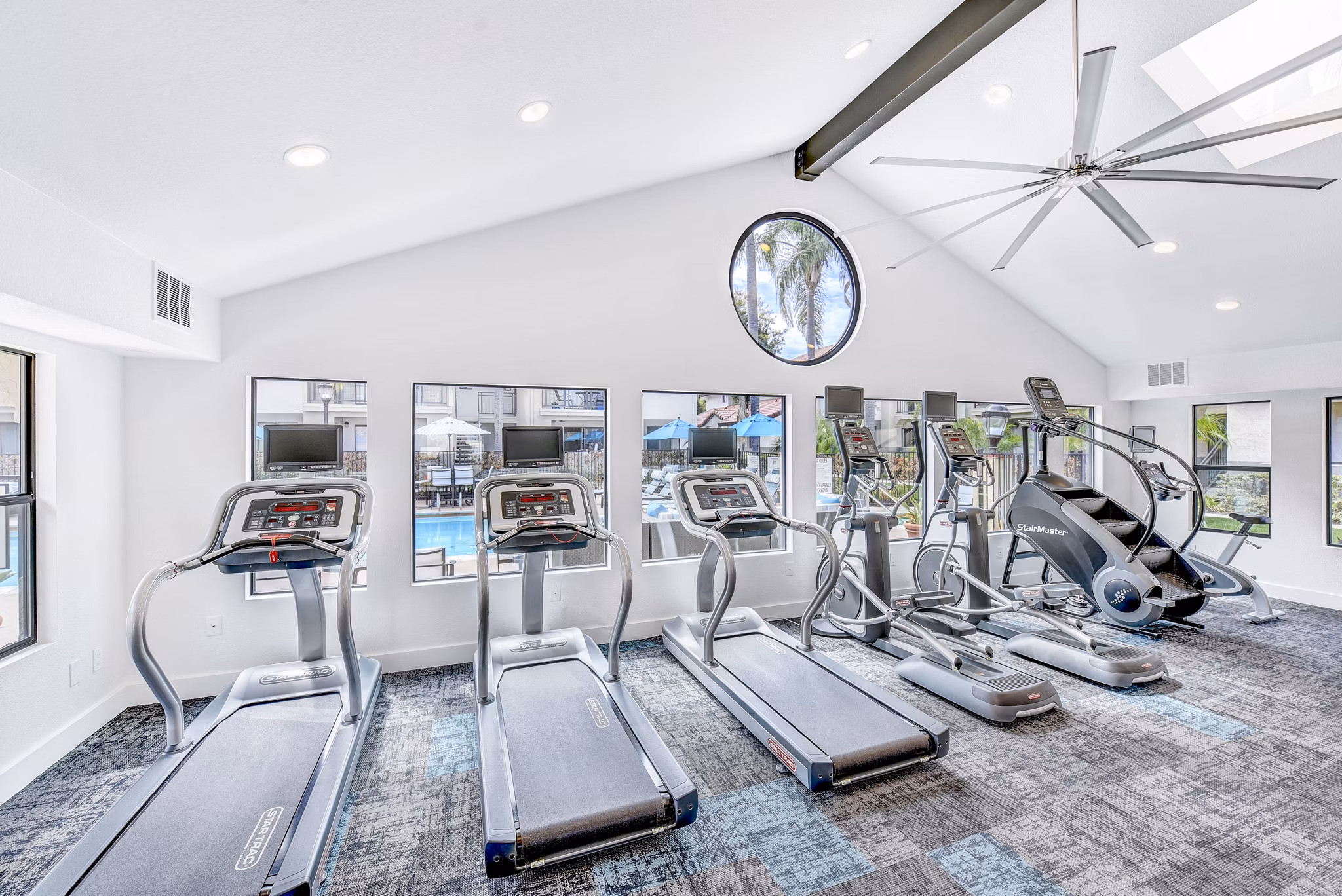 Altair Apartments: State-of-the-art fitness center with modern equipment and spacious workout areas, perfect for luxury living