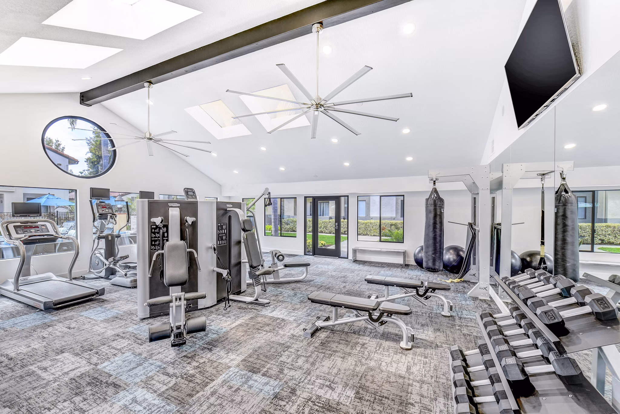 State-of-the-art fitness center at Altair Apartments featuring modern equipment for luxury living