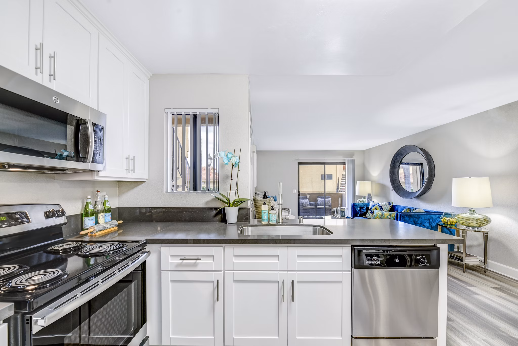 Modern kitchen with sleek cabinetry and stainless steel appliances at Altair Apartments