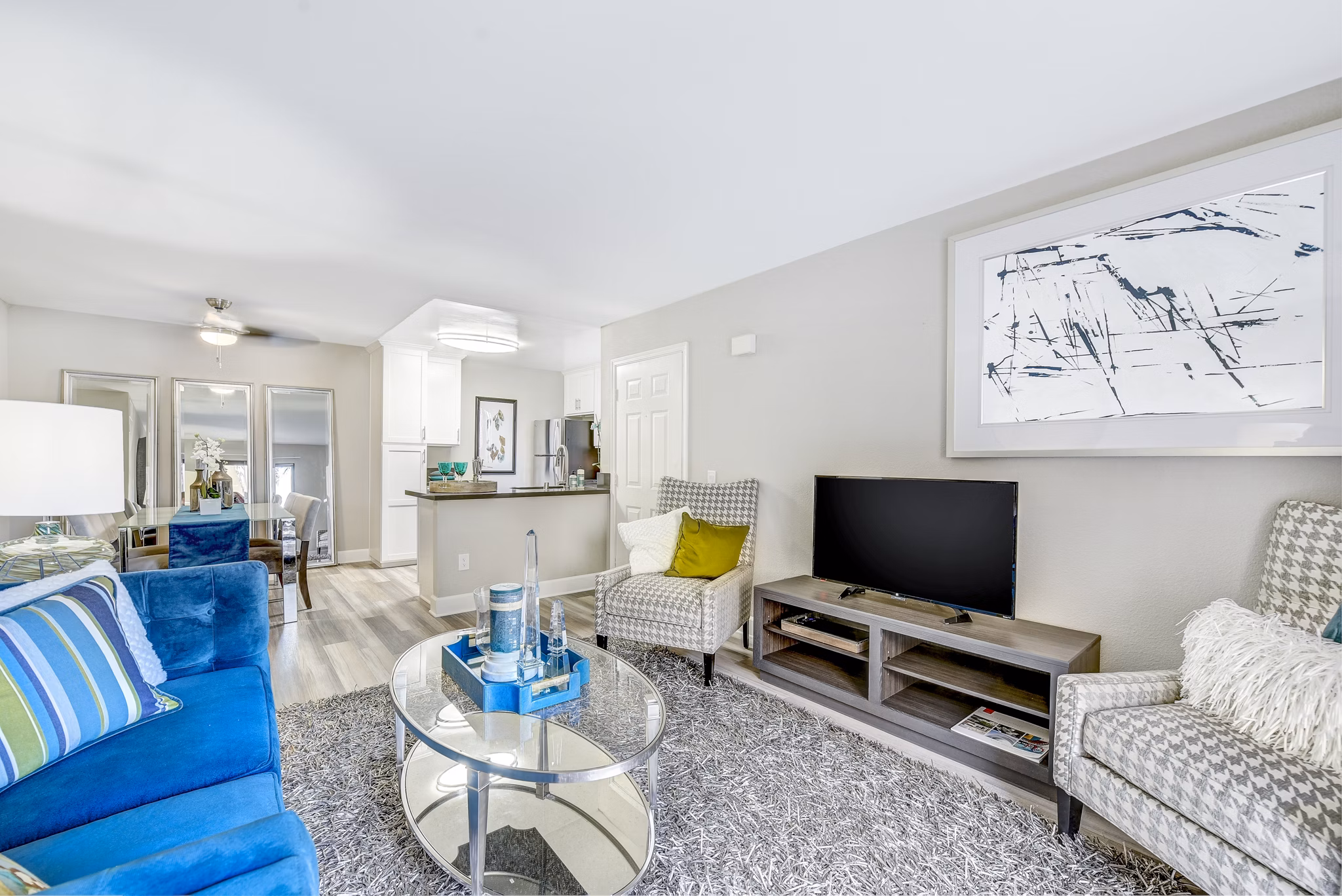 Living room with modern furnishings and natural light at Altair Apartments