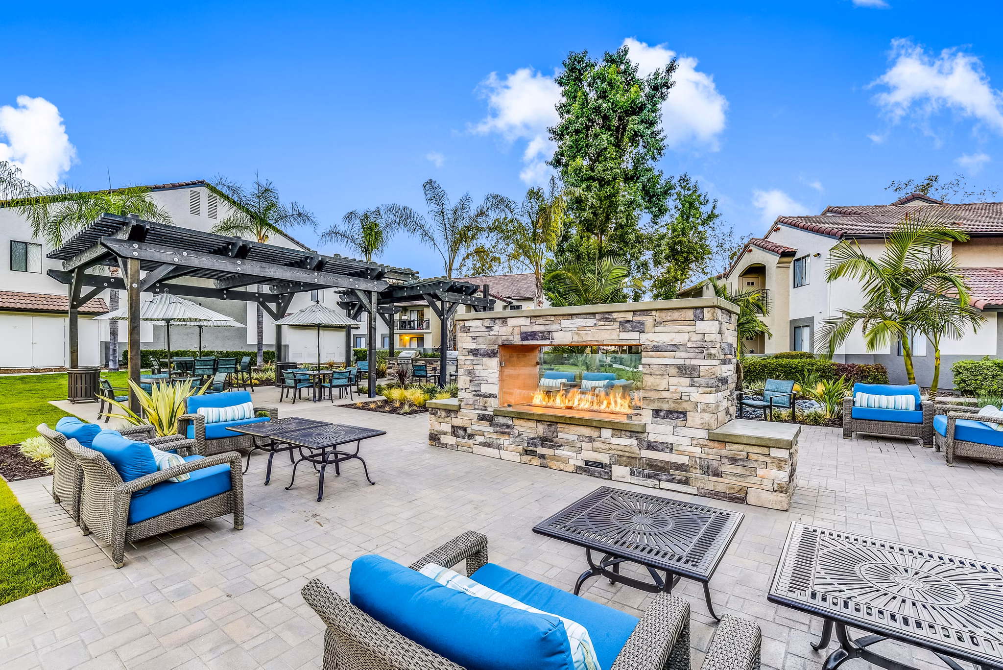 Fire pit and grill patio at Altair Apartments, offering luxury outdoor living spaces at this Greystar managed property