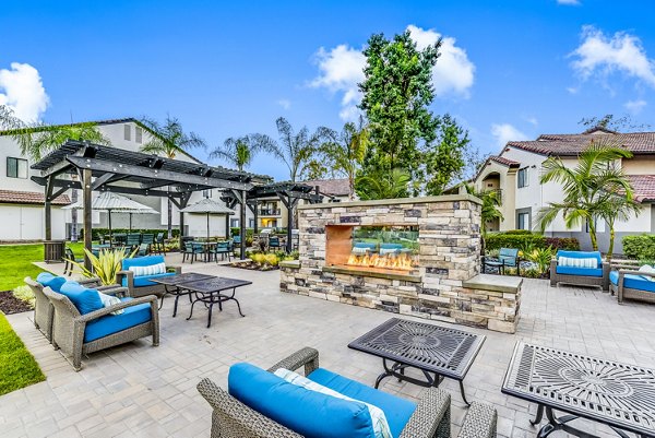 Fire pit and grill patio at Altair Apartments, offering luxury outdoor living spaces at this Greystar managed property