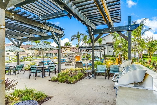 fire pit/grill area/patio at Altair Apartments