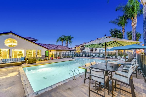 Altair Apartments: Outdoor pool with sun loungers and scenic view, perfect for relaxation at luxury apartments