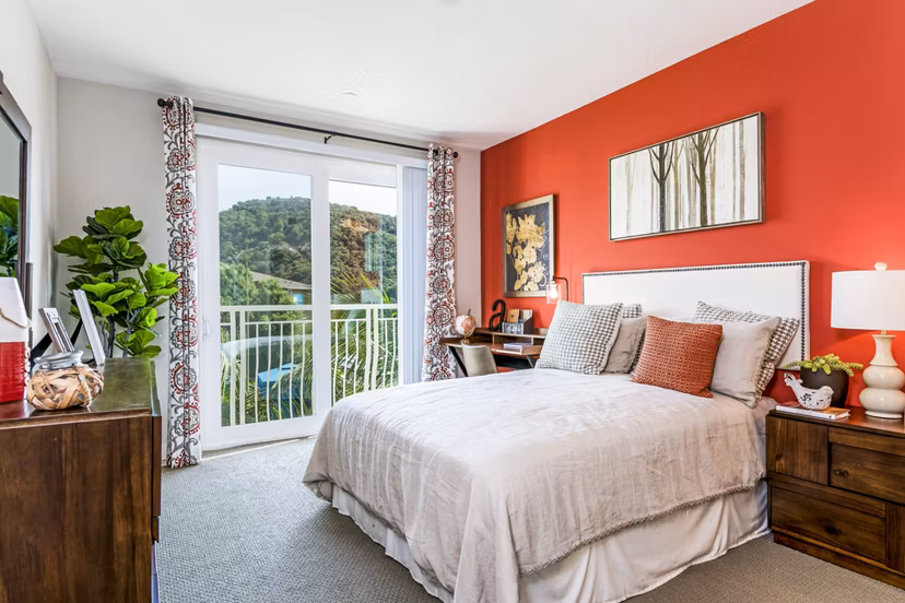 Altura Apartments: Elegant bedroom with stylish decor and plush bedding in luxury Greystar community