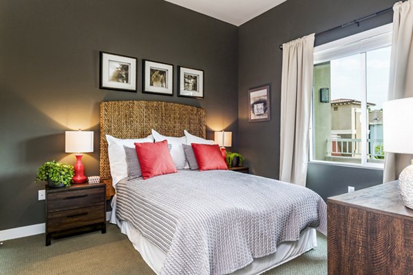 Cozy bedroom with modern decor and spacious layout at Altura Apartments, a luxurious Greystar community