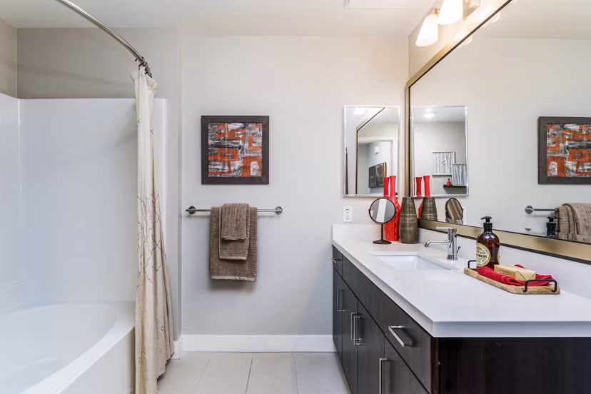 Bathroom featuring modern fixtures and marble countertops at Altura Apartments in luxury Greystar community