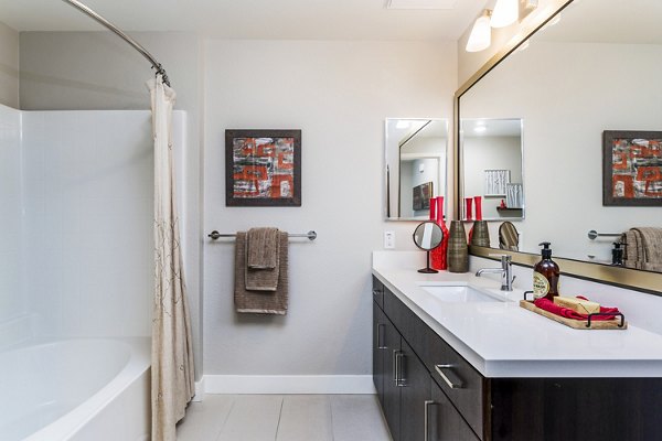 Bathroom featuring modern fixtures and marble countertops at Altura Apartments in luxury Greystar community