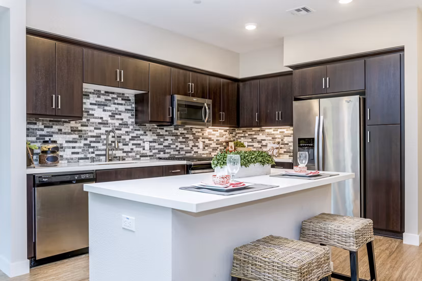 Modern kitchen with sleek cabinetry and stainless steel appliances at Altura Apartments in a luxury Greystar community