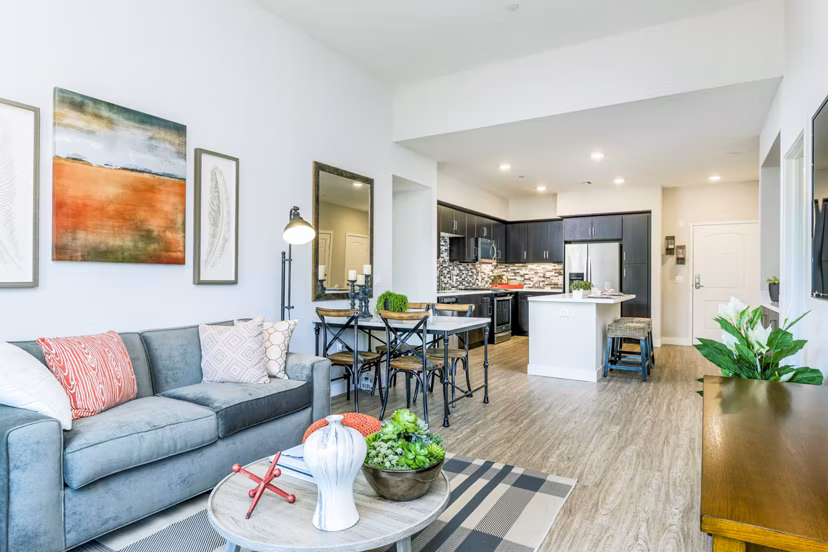 Spacious living room with modern furnishings at Altura Apartments in the luxury Greystar community