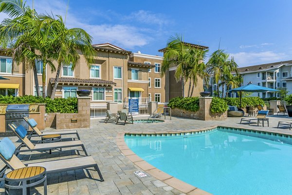 Relaxing outdoor pool area at Altura Apartments, a luxurious community by Greystar