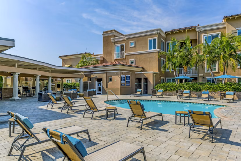 Relaxing poolside retreat at Altura Apartments with luxury amenities in vibrant city setting