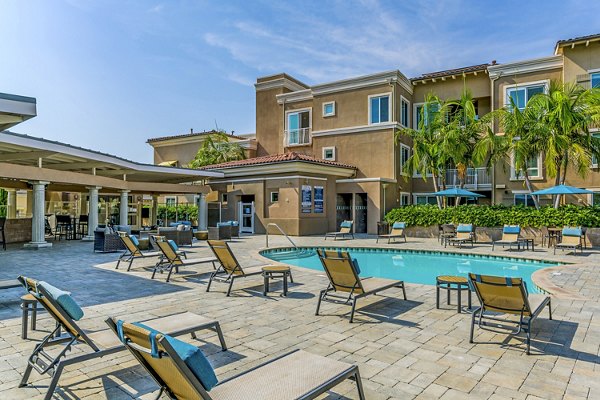 Relaxing poolside retreat at Altura Apartments with luxury amenities in vibrant city setting