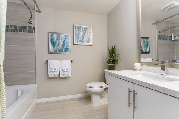 Modern bathroom with sleek fixtures at Avino Apartments luxury community