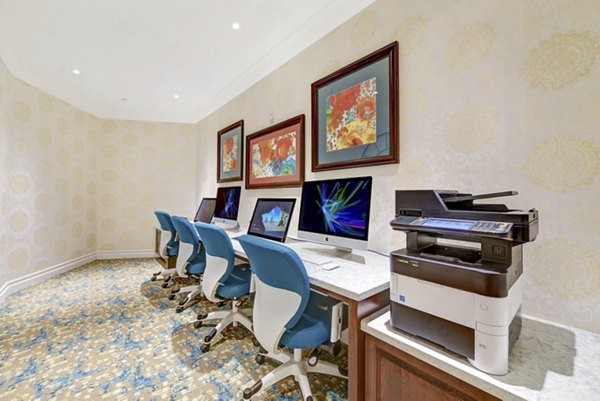 Business center with modern workstations at Avino Apartments