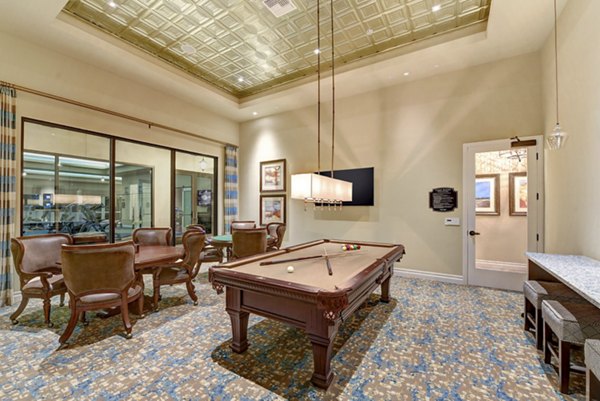 Game room boasting billiards table and lounge seating at Avino Apartments