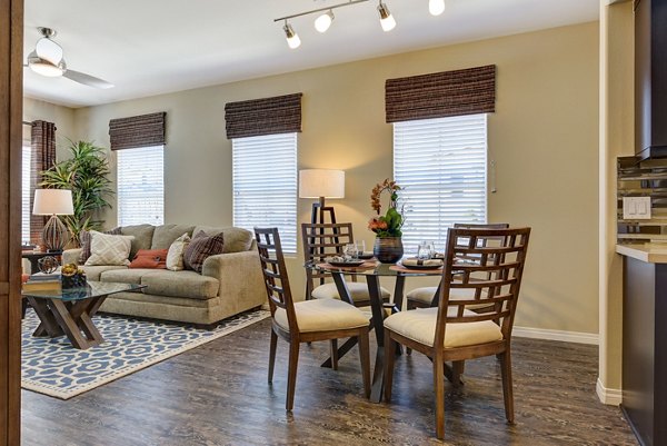 Elegant dining area with modern furnishings at Avino Apartments