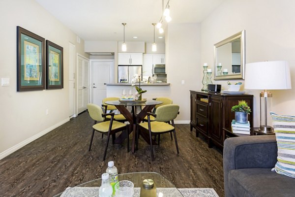 Dining area with elegant lighting and modern furnishings at Avino Apartments, Greystar luxury community in a desirable neighborhood