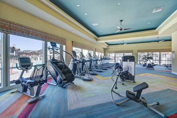 Modern fitness center with state-of-the-art equipment at Avino Apartments, offering a premium workout experience for residents