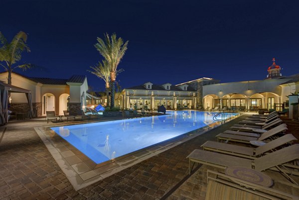 Outdoor pool with lounging area at Avino Apartments, Greystar luxury apartments
