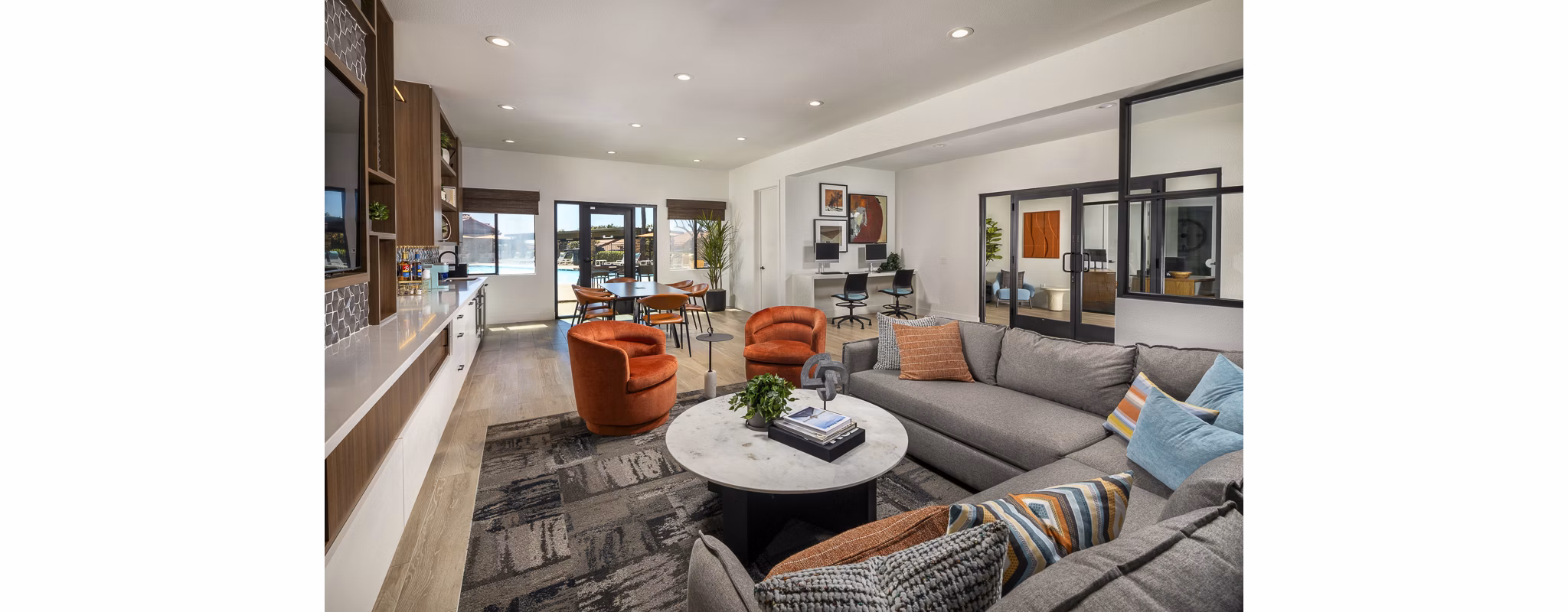 Modern clubhouse with spacious seating and entertainment areas at Bella Terra Apartments in vibrant luxury community
