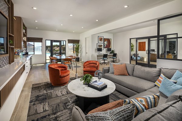 Modern clubhouse with spacious seating and entertainment areas at Bella Terra Apartments in vibrant luxury community
