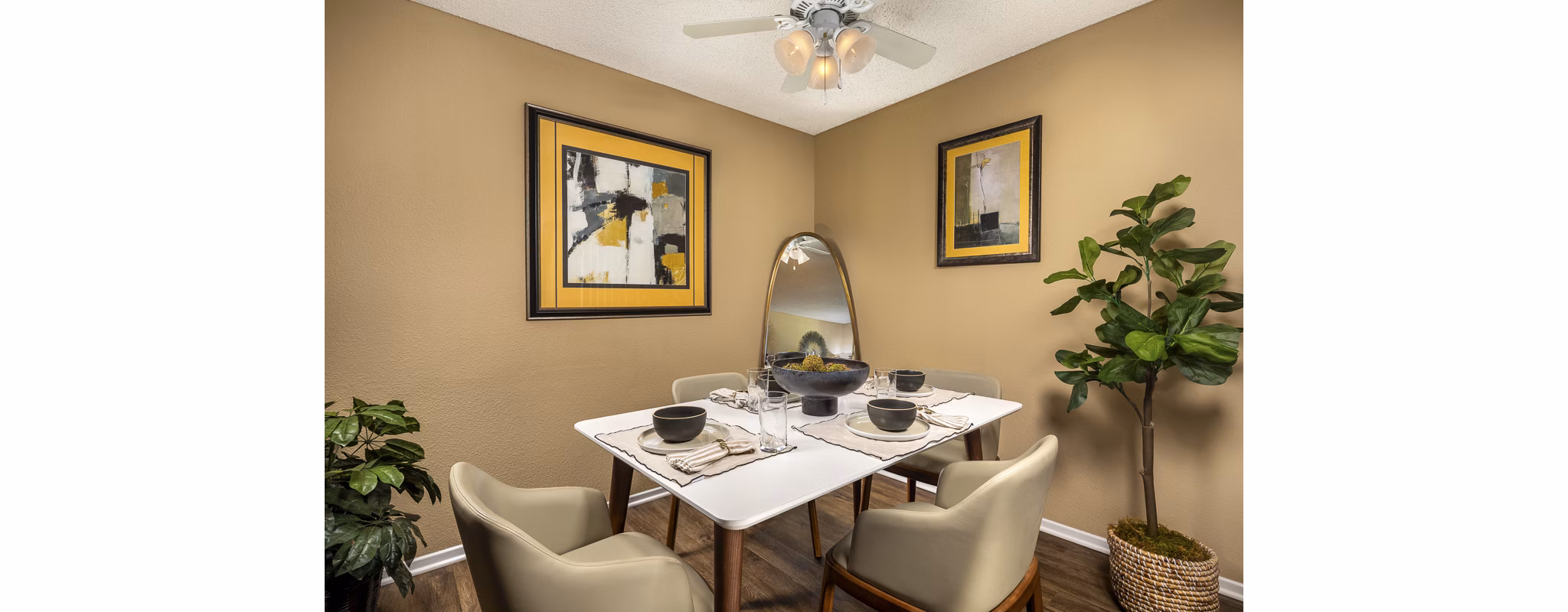 Bella Terra Apartments: Elegant dining area featuring modern furnishings and large windows