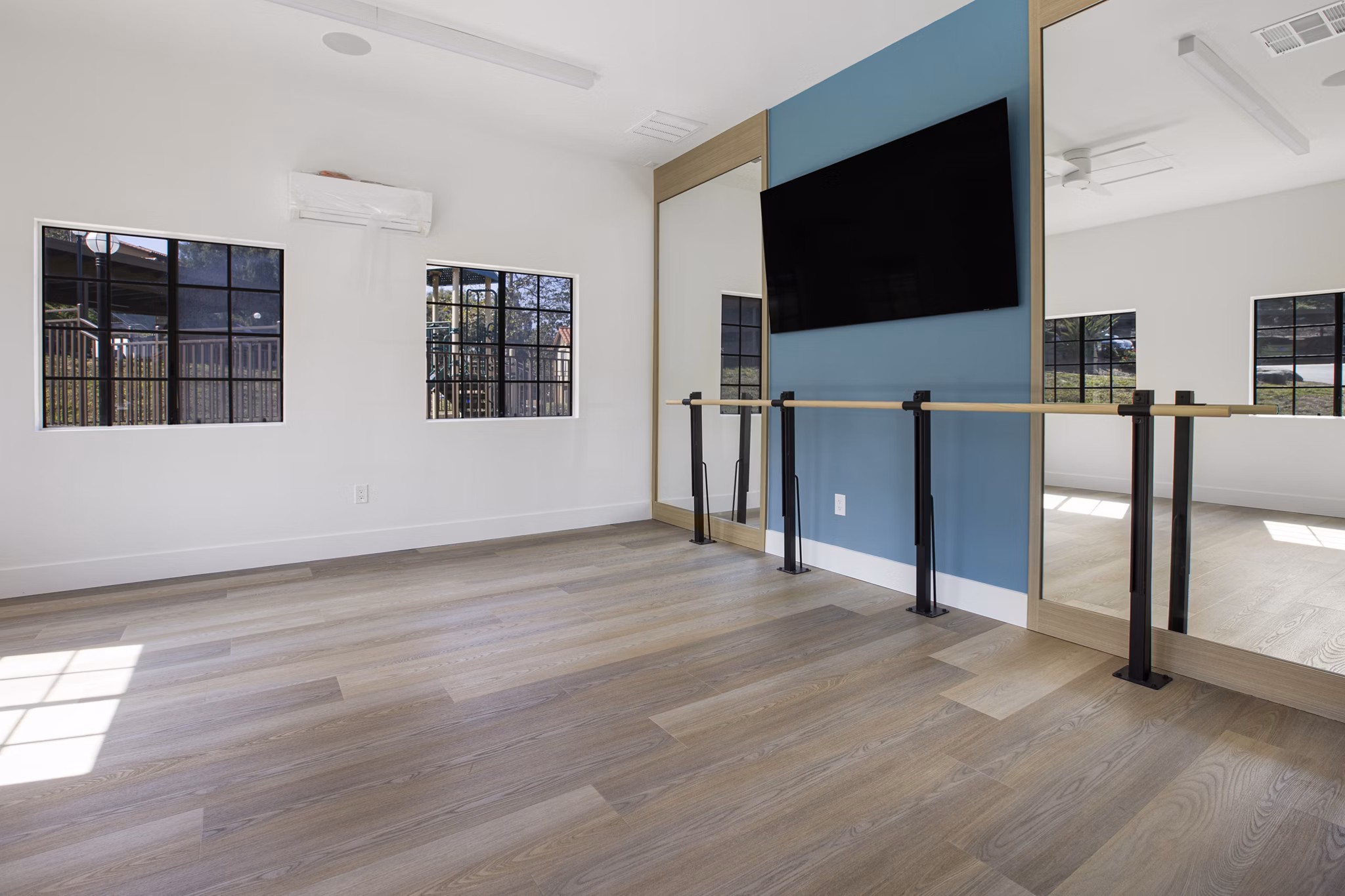 Yoga/spin studio with modern equipment at Bella Terra Apartments