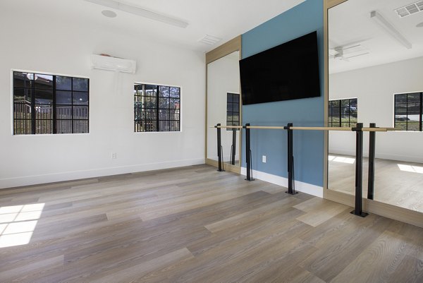 Yoga/spin studio with modern equipment at Bella Terra Apartments