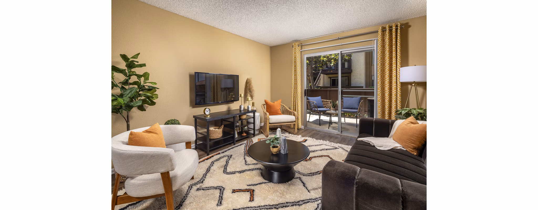 Elegant living room with modern decor and plush seating at Bella Terra Apartments