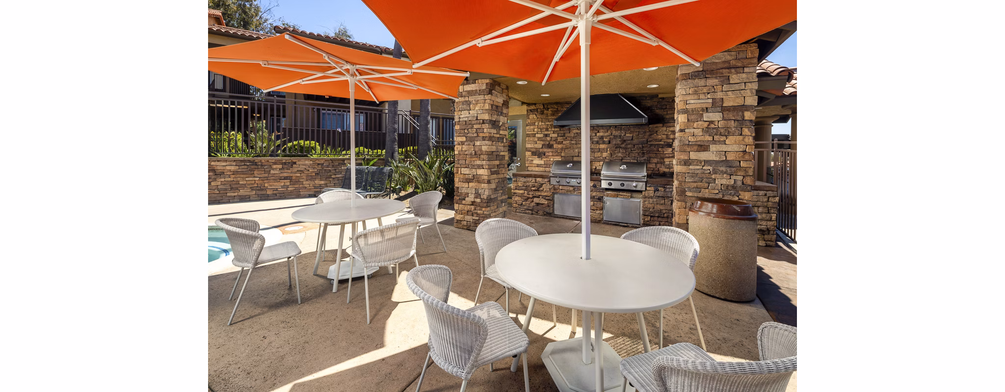 Bella Terra Apartments: Lush courtyard with landscaped gardens, seating areas, and walking paths for relaxation