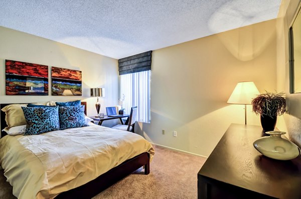 Bedroom featuring modern design and cozy decor at The Casas Apartments