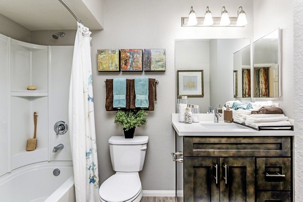 Bathroom featuring modern fixtures and sleek design at The Casas Apartments