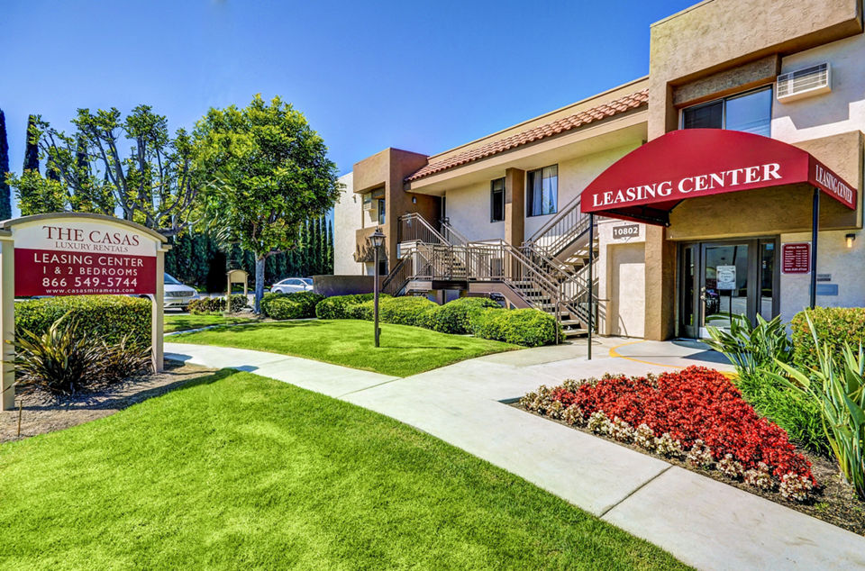 Clubhouse with modern design and comfortable seating at The Casas Apartments leasing office