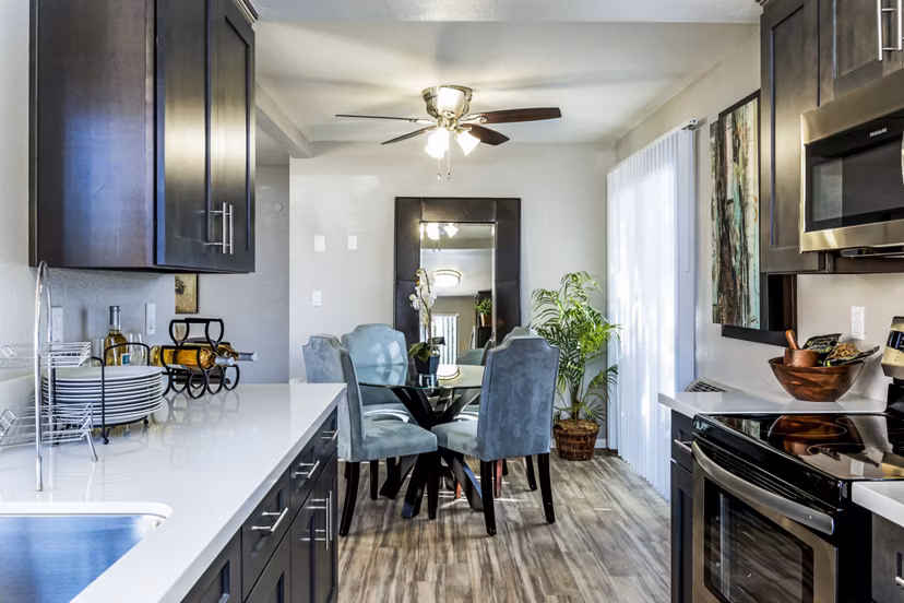 Dining room with elegant furnishings at The Casas Apartments, offering luxury living experiences