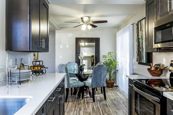 Dining room with elegant furnishings at The Casas Apartments, offering luxury living experiences