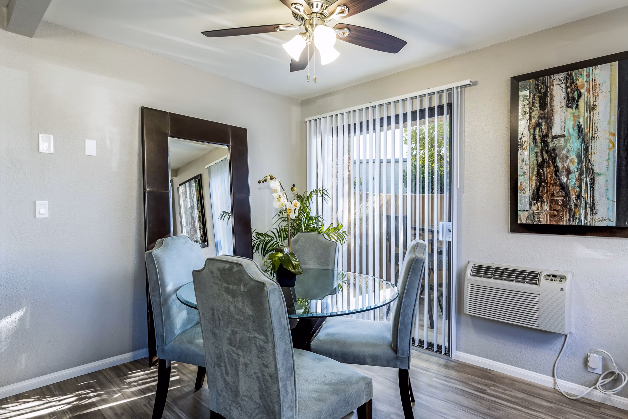 Dining room featuring elegant furnishings and modern lighting at The Casas Apartments