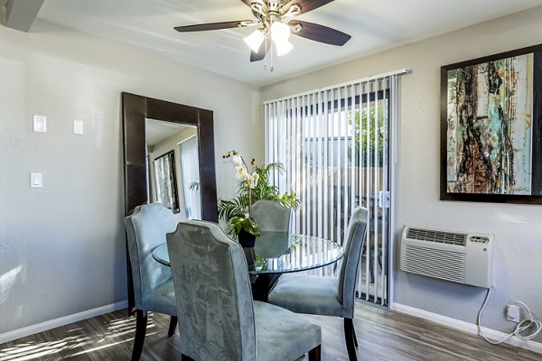 Dining room featuring elegant furnishings and modern lighting at The Casas Apartments